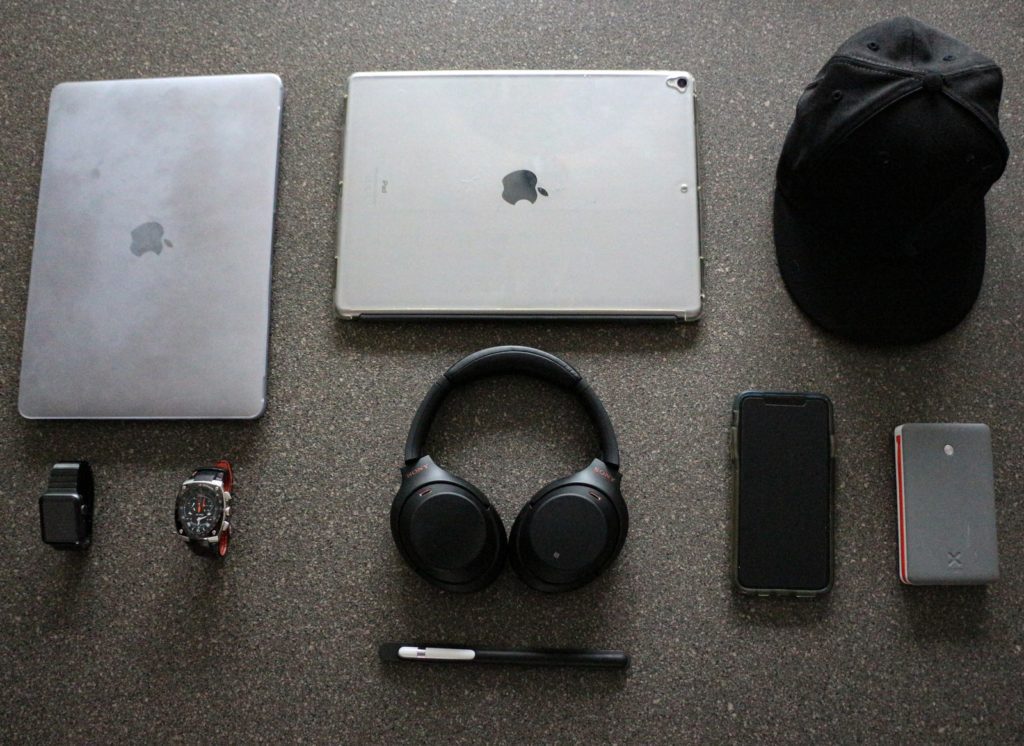 black wireless headphones beside iPad