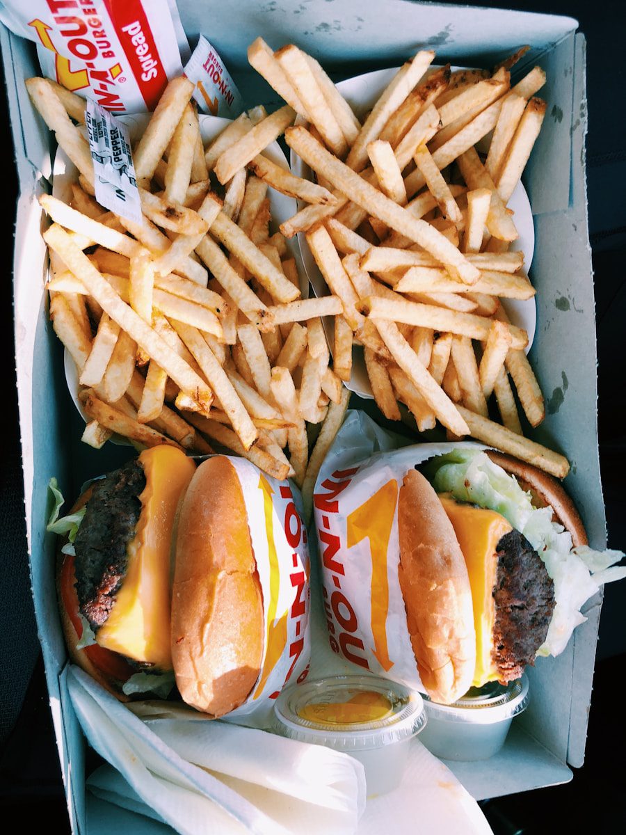 burgers and fries inside box burning calories